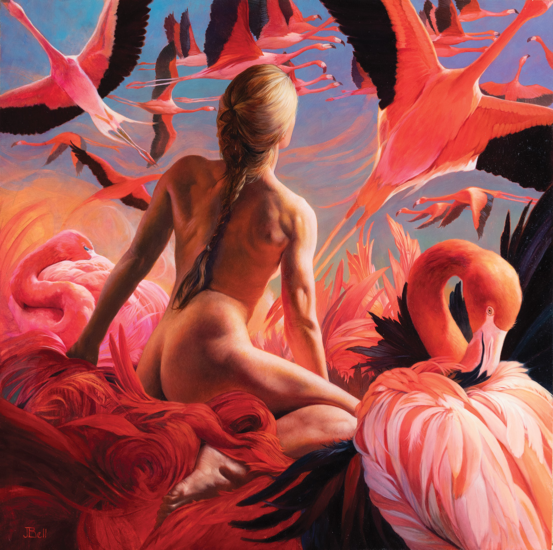 A woman starring up at flying flamingoes.